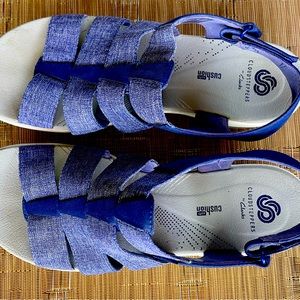 Clarks Cloudsteppers with adjustable Velcro strap.